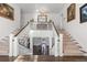 Stunning double staircase with white railings and hardwood floors at 930 E 7Th Ave, Denver, CO 80218