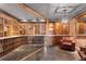 Elegant wine cellar with extensive wooden racking and seating area at 930 E 7Th Ave, Denver, CO 80218