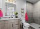 Contemporary bathroom featuring a stone-tiled shower, sleek vanity, and modern finishes at 1587 Arrowpoint Ct, Franktown, CO 80116