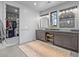 Modern bathroom with double sinks, antler mirror accents, and walk-in closet at 1587 Arrowpoint Ct, Franktown, CO 80116