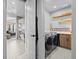 Modern bathroom featuring a soaking tub and view of the bedroom at 1587 Arrowpoint Ct, Franktown, CO 80116