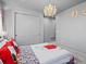 Cozy bedroom with a playful Snoopy theme, closet, soft carpet, and chandelier lighting at 1587 Arrowpoint Ct, Franktown, CO 80116