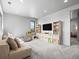 Spacious bonus room with built-in shelves, cozy seating, and ample natural light at 1587 Arrowpoint Ct, Franktown, CO 80116