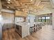 Kitchen boasts a large island with seating, stainless steel appliances, and scenic views at 1587 Arrowpoint Ct, Franktown, CO 80116