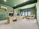 Bright and spacious office space featuring modern furniture, dual desk setup, and natural light with scenic views at 1587 Arrowpoint Ct, Franktown, CO 80116