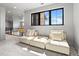 Upstairs loft area with comfortable seating and a view of the home's unique architectural details at 1587 Arrowpoint Ct, Franktown, CO 80116
