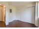 Bedroom with large closets, neutral colors, and wood floor at 2223 S Buckley Rd # 102, Aurora, CO 80013
