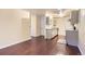 Spacious living area with hardwood floors leading to the modern kitchen at 2223 S Buckley Rd # 102, Aurora, CO 80013