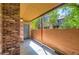 Outdoor patio features brick facade and lush tree views at 2223 S Buckley Rd # 102, Aurora, CO 80013