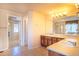 Spacious bathroom with double sink vanity, large mirror and tile flooring at 1704 Parkdale Cir, Erie, CO 80516