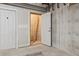 Unfinished basement space with exposed concrete walls and open doorway at 3030 Wyandot St # 4, Denver, CO 80211