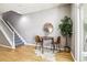 Dining area with round table, two chairs, and stairway at 3030 Wyandot St # 4, Denver, CO 80211