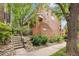Charming brick building with lush landscaping and inviting entrance steps to the covered entryway, 3030 at 3030 Wyandot St # 4, Denver, CO 80211