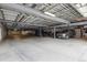 Large, unfinished garage with visible support structures and multiple parking spaces at 3030 Wyandot St # 4, Denver, CO 80211