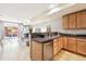 A modern kitchen featuring light wood cabinets and stainless steel appliances open to the living area at 3030 Wyandot St # 4, Denver, CO 80211