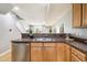 A modern kitchen featuring light wood cabinets, stainless steel appliances, and a kitchen sink at 3030 Wyandot St # 4, Denver, CO 80211