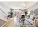 Bright living room featuring a fireplace, balcony, and modern decor at 3030 Wyandot St # 4, Denver, CO 80211