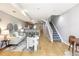 Open-concept living room with adjacent kitchen bar and stairway at 3030 Wyandot St # 4, Denver, CO 80211