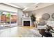 Bright living room featuring a fireplace and balcony at 3030 Wyandot St # 4, Denver, CO 80211