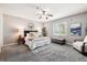 Spacious main bedroom with a large window, ceiling fan, carpet flooring and stylish decor at 3030 Wyandot St # 4, Denver, CO 80211