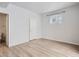 Bedroom with light walls, a window, and ensuite bathroom at 7440 S Blackhawk St # 9-108, Englewood, CO 80112