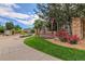 Inviting community entrance with stone pillars and the welcoming Windmill Creek signage at 7440 S Blackhawk St # 9-108, Englewood, CO 80112