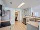 Modern kitchen featuring stainless steel appliances, light countertops, and convenient access to laundry at 7440 S Blackhawk St # 9-108, Englewood, CO 80112