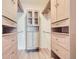 Spacious walk-in closet with custom wood shelving and ample storage space at 7440 S Blackhawk St # 9-108, Englewood, CO 80112