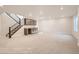 Spacious basement featuring a wet bar, carpeted floors, and ample room for recreation and storage at 903 W 129Th Pl, Westminster, CO 80234