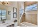 Well-lit bathroom features stylish tilework and a window view at 903 W 129Th Pl, Westminster, CO 80234