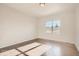 Sun-filled bedroom with a large window showcasing a serene view, complemented by hardwood floors at 903 W 129Th Pl, Westminster, CO 80234