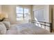 Sunlit bedroom features a large window with neighborhood views at 903 W 129Th Pl, Westminster, CO 80234