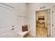 Cozy entryway with bench seating and view into laundry room at 903 W 129Th Pl, Westminster, CO 80234