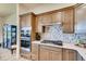Stylish kitchen featuring stainless steel appliances, a mosaic backsplash, and ample cabinet space at 903 W 129Th Pl, Westminster, CO 80234