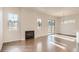Open-concept living area with fireplace and hardwood floors at 903 W 129Th Pl, Westminster, CO 80234