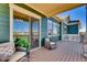 Charming porch with cozy seating, views, and access to indoor living through sliding glass door at 903 W 129Th Pl, Westminster, CO 80234