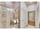 Glass shower with decorative tiles and built-in niche shelf, complemented by soft neutral colors at 903 W 129Th Pl, Westminster, CO 80234