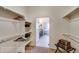 Spacious walk-in closet with built-in shelving and a view into the Primary bathroom at 903 W 129Th Pl, Westminster, CO 80234