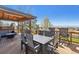 Inviting outdoor dining area on the deck, featuring mountain views at 9895 Wyecliff Dr, Highlands Ranch, CO 80126