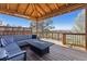Covered deck featuring seating and a fire pit, perfect for outdoor enjoyment at 9895 Wyecliff Dr, Highlands Ranch, CO 80126