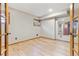 Unfinished basement area with light wood floors and a small window at 9895 Wyecliff Dr, Highlands Ranch, CO 80126