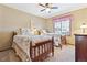 Inviting bedroom with twin beds, vintage accents, and a sunny window at 9895 Wyecliff Dr, Highlands Ranch, CO 80126