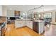 Open kitchen features granite countertops and stainless steel appliances at 9895 Wyecliff Dr, Highlands Ranch, CO 80126