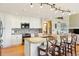 Bright kitchen features a center island with seating, granite countertops, and stainless steel appliances at 9895 Wyecliff Dr, Highlands Ranch, CO 80126