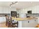 Spacious kitchen with island, bar seating, stainless appliances and ample cabinet space at 9895 Wyecliff Dr, Highlands Ranch, CO 80126