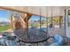 Covered patio features an outdoor dining area and stairs to the upper level at 9895 Wyecliff Dr, Highlands Ranch, CO 80126