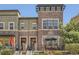 Charming brick townhome with a cozy front patio and manicured landscaping at 9486 Elmhurst Ln # D, Highlands Ranch, CO 80129