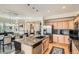 Spacious kitchen featuring granite countertops, stainless steel appliances, and a large island at 9486 Elmhurst Ln # D, Highlands Ranch, CO 80129