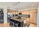 Modern kitchen with granite island, stainless appliances, and ample cabinet space at 9486 Elmhurst Ln # D, Highlands Ranch, CO 80129