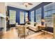Stylish living room with hardwood floors, ample natural light, and elegant decor at 9486 Elmhurst Ln # D, Highlands Ranch, CO 80129